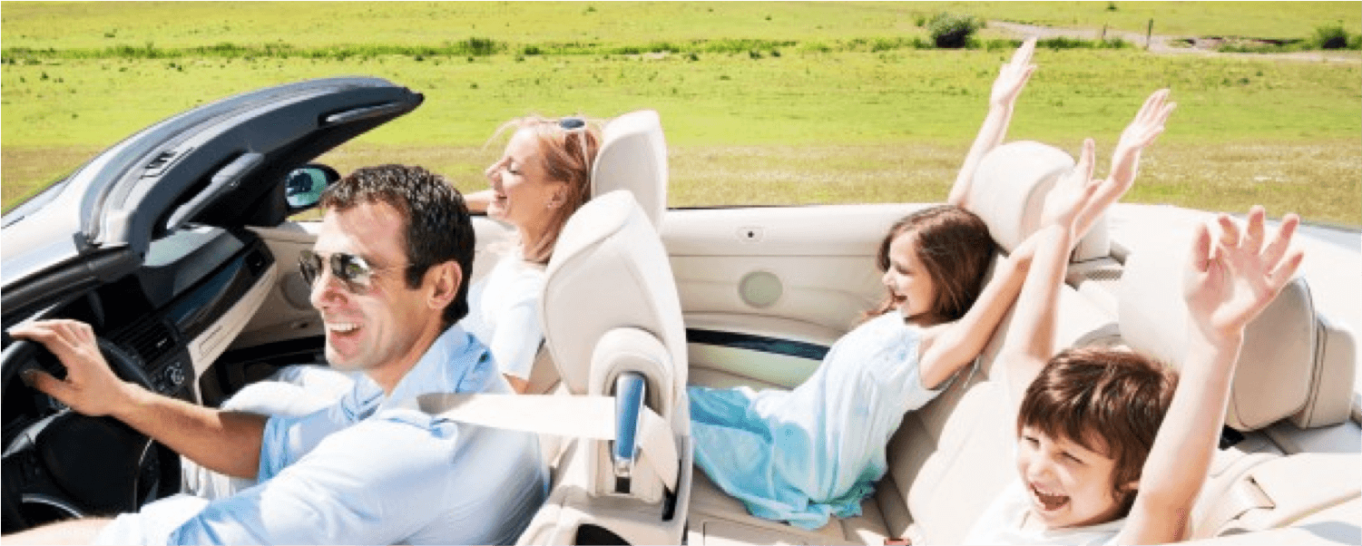 Family driving in convertible